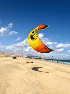 a large kite is being flown on a beach at Playa Paraiso DolceVita in Costa Calma