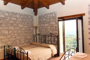 A bed or beds in a room at Masseria Mastrangelo