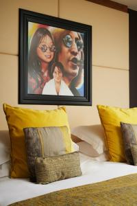 
a bed with a picture of a woman on it at Hard Days Night Hotel in Liverpool
