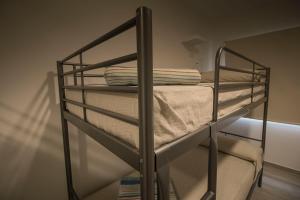 a couple of bunk beds in a room at Albergue Casa Manola in Abeleiras