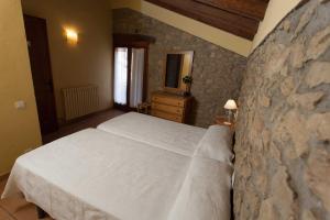Postel nebo postele na pokoji v ubytování Les Cases De Borrells