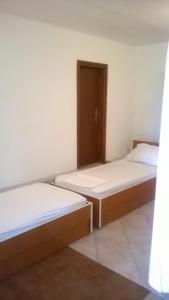 Postel nebo postele na pokoji v ubytování Apartments Zovko