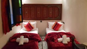 Postel nebo postele na pokoji v ubytování Riad Africa