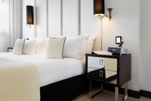Кровать или кровати в номере Meliá Milano