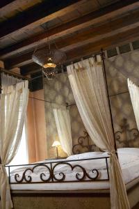 Posteľ alebo postele v izbe v ubytovaní Novecento Boutique Hotel