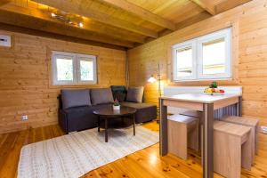 a living room with a couch and a table at U Marleny in Ustka
