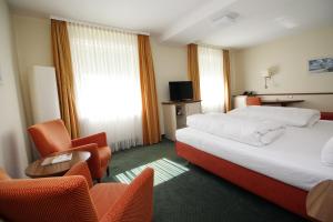Postel nebo postele na pokoji v ubytování Hotel Leopold + 37 fotografií