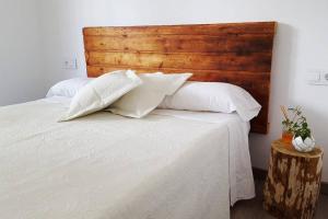 A bed or beds in a room at Casa Martí