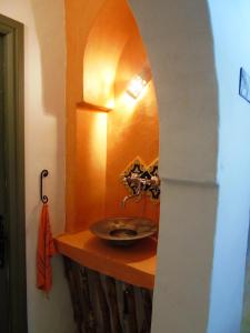 a bathroom with a sink on a wooden counter at Dar Aladin in Arkou