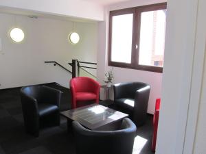 Posezení v ubytování Hôtel Le Saint Joseph