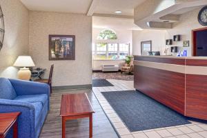 a living room with a couch and a table at Americas Best Value Inn & Suites Maryville in Maryville