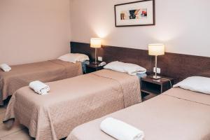 Postel nebo postele na pokoji v ubytování Hotel Solano