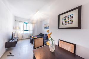 a living room with a table and a couch at Family Vacation by Lake Kinneret in Tiberias