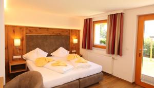 Postel nebo postele na pokoji v ubytování Aparthotel DAS Hochkönig