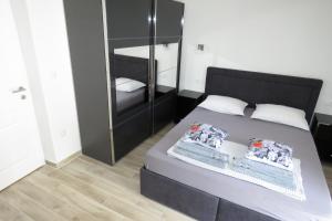 Postel nebo postele na pokoji v ubytování Lux Dalmatia I & R