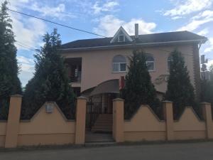 a house with a fence in front of it at L&M in Mukacheve