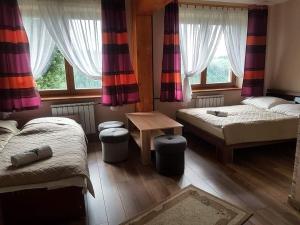 Postel nebo postele na pokoji v ubytování Pod Tatrami
