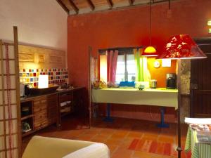 a kitchen with a sink and a table in it at Quinta dos Trevos - Artes e Ofícios in Ladoeiro