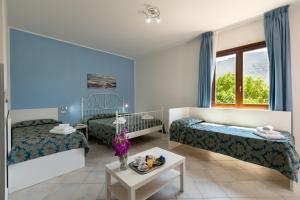 Postel nebo postele na pokoji v ubytování Hotel Achibea