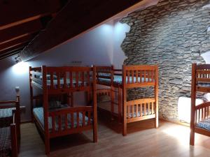 A bed or beds in a room at Refugi Casa Canelo