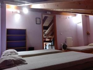 A bed or beds in a room at Refugi Casa Canelo