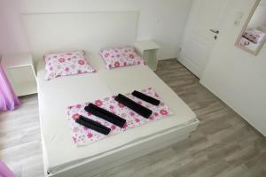 Postel nebo postele na pokoji v ubytování Lux Dalmatia I & R