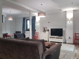TV in/ali zabaviščno središče v nastanitvi Apartmani Simić Valjevo