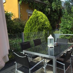 a table and chairs on a patio at Ferienwohnung Petra in Rust