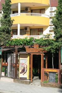 a building with a sign in front of it at Gerdjika Hotel in Nesebar