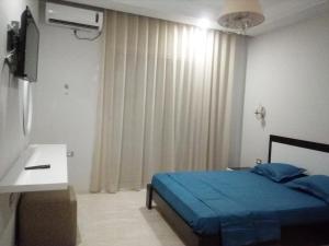 Кровать или кровати в номере London House