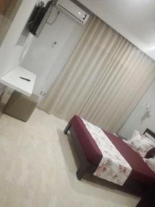 Кровать или кровати в номере London House