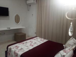 Кровать или кровати в номере London House