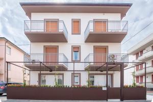 a white building with balconies and flowers on it at Casa Ercoli B&B in Vinci