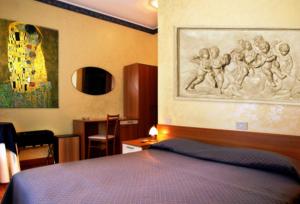 Letto o letti in una camera di Albergo Dei Leoni