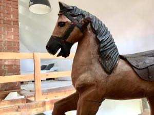 a statue of a horse on display in a museum at KÉSA Faház in Balatonlelle