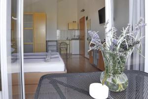 Ένα ή περισσότερα κρεβάτια σε δωμάτιο στο Apartmani Olives