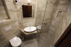 Vannituba majutusasutuses Apis Hotel