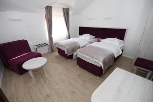 Voodi või voodid majutusasutuse Apis Hotel toas