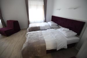 Voodi või voodid majutusasutuse Apis Hotel toas