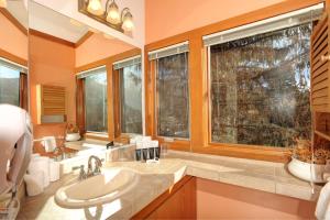 a bathroom with a sink and two windows at Aspen Ridge Condominiums by Keystone Resort in Keystone