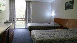Un pat sau paturi într-o cameră la Aristos Express CDMX