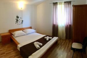 Ένα ή περισσότερα κρεβάτια σε δωμάτιο στο Apartmani Morango
