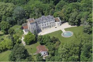 an aerial view of a large house in the forest at Chateau d'Hordosse in Andiran