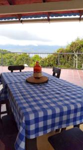 a blue and white checkered table with a pot on top at Mirador de Calima in Calima