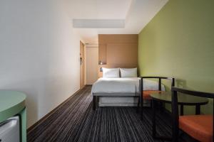 a hotel room with a bed and a table at the b ikebukuro in Tokyo +37 photos