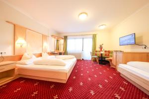 Ein Bett oder Betten in einem Zimmer der Unterkunft Superior Hotel Persal