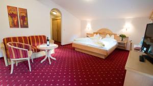 Ein Bett oder Betten in einem Zimmer der Unterkunft Superior Hotel Persal