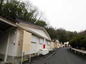 a row of buildings parked next to a street at Hotel Fine Shimane Matsue (Adult Only) in Matsue