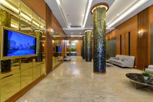 TV a/nebo společenská místnost v ubytování Arawana Regency Park Sukhumvit