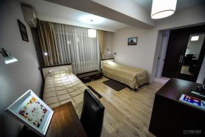 เตียงในห้องที่ Garni Hotel 018 In